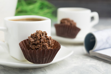 Welcome dessert with coffee, chocolate sweets with nuts and shinning topping