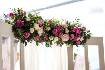 arch decorated with pink and white flowers