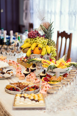 candy bar decorated by delicious sweet buffet with cupcakes and other desserts/candies,happy birthday concept