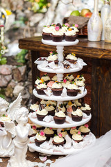 candy bar decorated by delicious sweet buffet with cupcakes and other desserts/candies,happy birthday concept