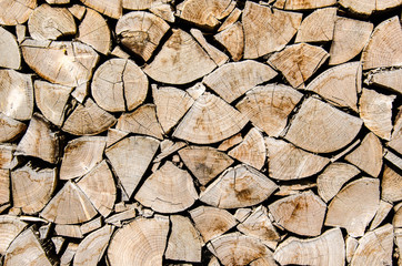 Firewood texture, Stack of wood, Pile of wood cut for fireplace, Wooden natural background, Pattern out of wood, Rough wooden floor, Background cut wood - 199579794