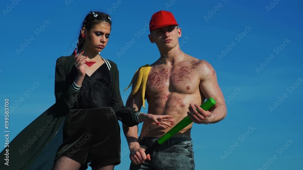 Canvas Prints muscle. strong man. girl with baseball bat. man with fit muscles, ab, torso.