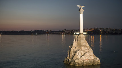 Fototapeta na wymiar Sevastopol, Crimea, Russia. Monument to sunken ships and flying seagulls.