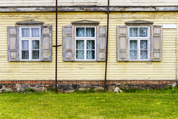 Old yellow wall with some windows