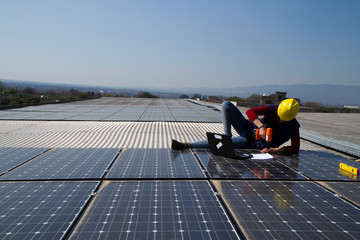 young engineer girl and an elderly skilled worker fitting a photovoltaic plant