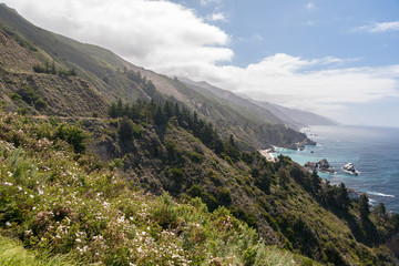 Fototapeta na wymiar A Panoramic View of Mountains Crashing into the Pacific Ocean off of Rout 1, Big Sur National Park, California