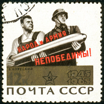 Ukraine - circa 2018: A postage stamp printed in USSR show Poster People and Army - are Invincible. Author V. Koretsky. Series: 20th Anniversary of Victory in the Second World War. Circa 1965.