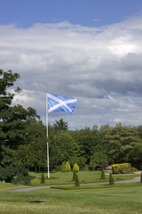 Scottish flag on the blue sky background