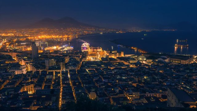 Naples, Italy. Time lapse of night aerial cityscape with skyline. View to the Vesuvius and seaport 