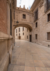 Fototapeta na wymiar Arch on Barchilla Street by Cathedral Valencia
