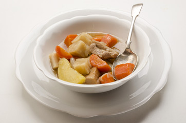 delicious home made irish stew in a white bowl