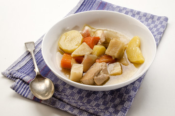 classic irish stew with a spoon and deep plate
