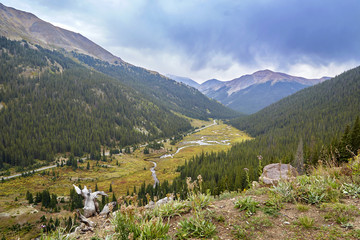 Fototapeta na wymiar Mountains with stream and road looking over the Continental Divide