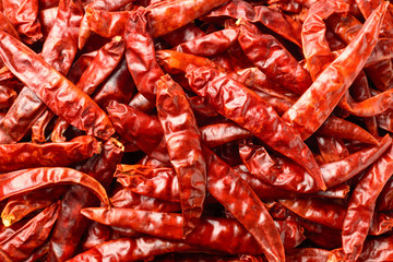 food background of dried red chilies, top view