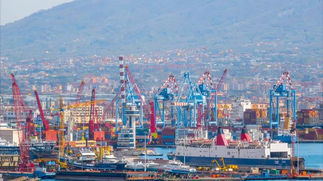 Time lapse of the sea port with a lot of cranes and cargo containers. Zoom effect