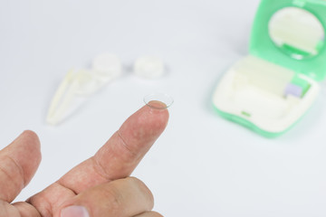 contact lens at the tip of the finger