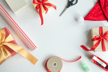 DIY presents for christmas. Top view of tools for wrap gift boxes on the white background. have a...