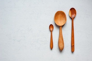 Wooden spoons are handmade in different sizes.
