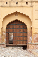Fototapeta na wymiar Wooden Door at Amer Fort, India