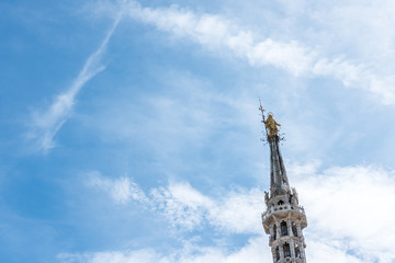 The Golden Madonnina on the top of Milan Duomo or cathedral, Italy.