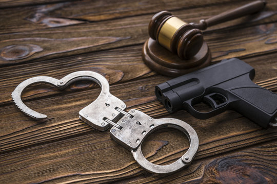 traumatic gun, hammer of the judge. Crime, robbery with the help of traumatic weapons, responsibility. committal and punishment, court and law