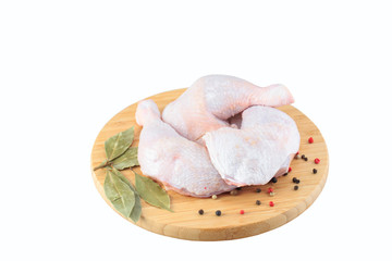 raw chicken legs on a white background