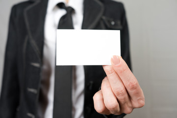 Businesswoman holding a business card. Mock up. Copy space.