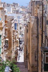 Very narrow street in Valletta, Europe. Old architecture style in Malta