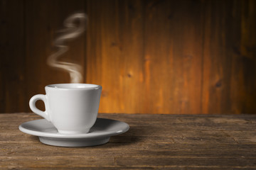 Cup of coffee on wooden table