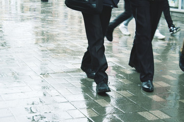 Person walking on the street in rainy day