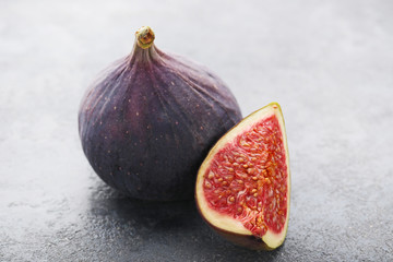 Ripe and sweet figs on wooden table