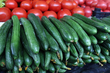Cucumbers and tomatoes. Fresh organic Homegrown Cucumbers and tomatoes at the open market. Vegetables salad background. 