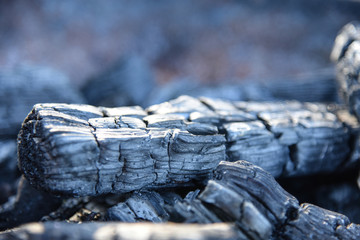 Black charcoal texture background selective focus