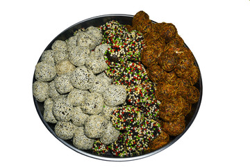 plate with multi-colored balls of oriental sweets isolated on white background..