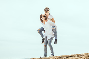 Obraz premium Two women having fun on the beach. Girls having fun and smiling