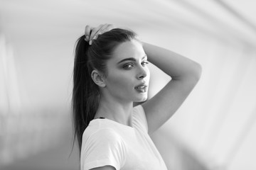 Naklejka premium Portrait of an attractive girl with gathered hair.