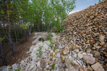 Underground old ore gold mine terricon slagheap rocks heap