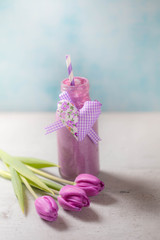Purple fresh smoothie with heart shaped ribbon. Mother day idea. Clean eating, detox, dieting, vegetarian, vegan, fitness, healthy lifestyle concept, Close-up