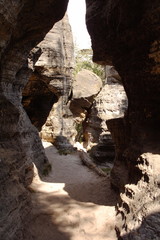 Sun casting shadows between rocks.