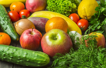 Assorted different fruits and vegetables as background. Healthy eating. Vegetarian food.