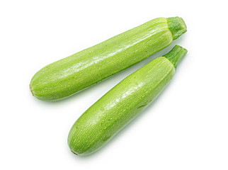 Green zucchini vegetables isolated on white background.