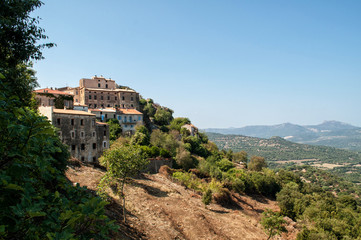 Fototapeta na wymiar A small village Sant'Antonino in the hills above the sea on the island of Corsica
