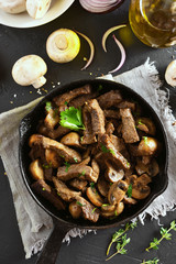 Beef stroganoff with mushrooms in frying pan