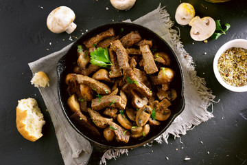 Beef stroganoff with mushrooms in frying pan