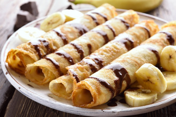 Crepes roll with banana slices