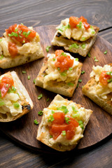 Sandwiches with scrambled eggs, green onion and tomato