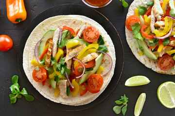 Tacos with chicken meat and vegetables