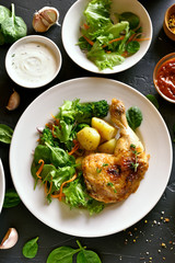 Chicken leg with potato and green salad