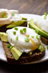 Sandwiches with poached eggs and avocado
