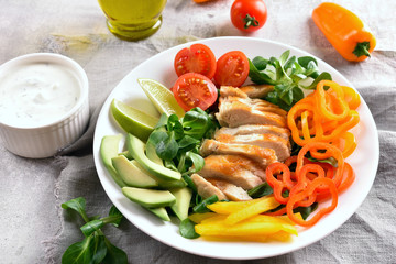 Vegetable salad with roasted chicken breasy